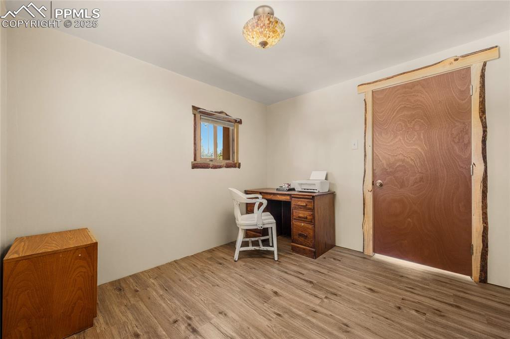 Image 12 of 27: Office space with light wood-type flooring