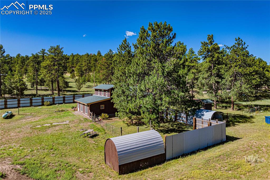 Image 26 of 27: View of yard featuring an outbuilding