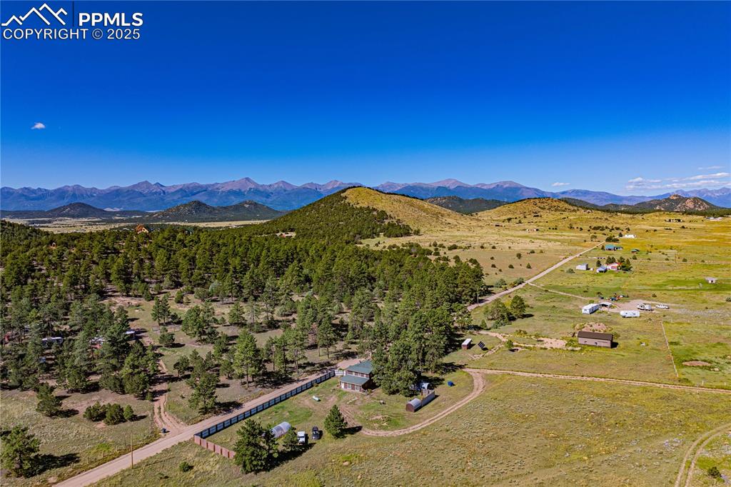 Image 27 of 27: View of rural area with a mountainous background