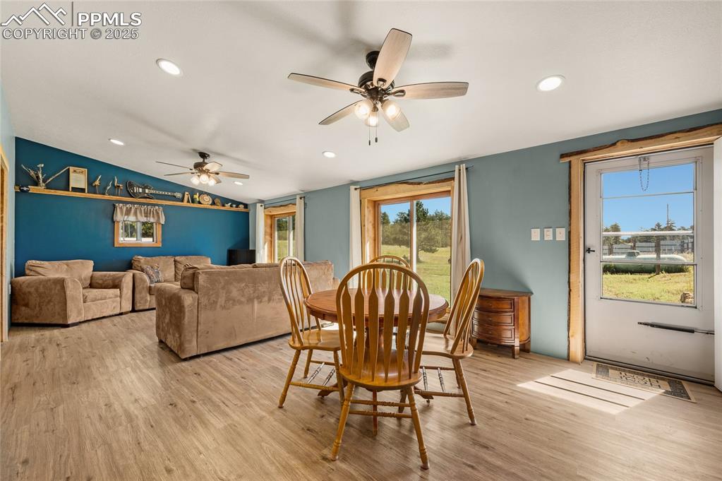 Image 6 of 27: Dining space featuring a ceiling fan, light wood-style floors, recessed lig