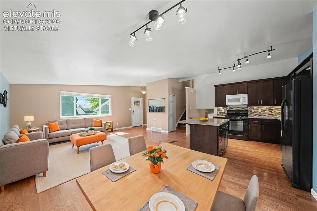Image 4 of 30: Virtually Staged Living and Dining Room