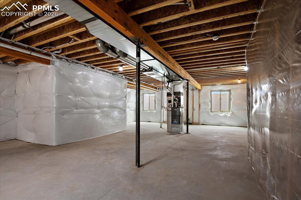 Image 34 of 45: Basement featuring heating unit