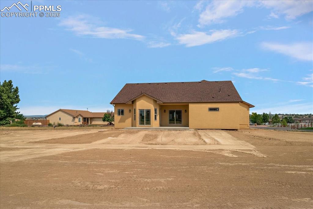 Image 40 of 45: View of front of property with stucco siding