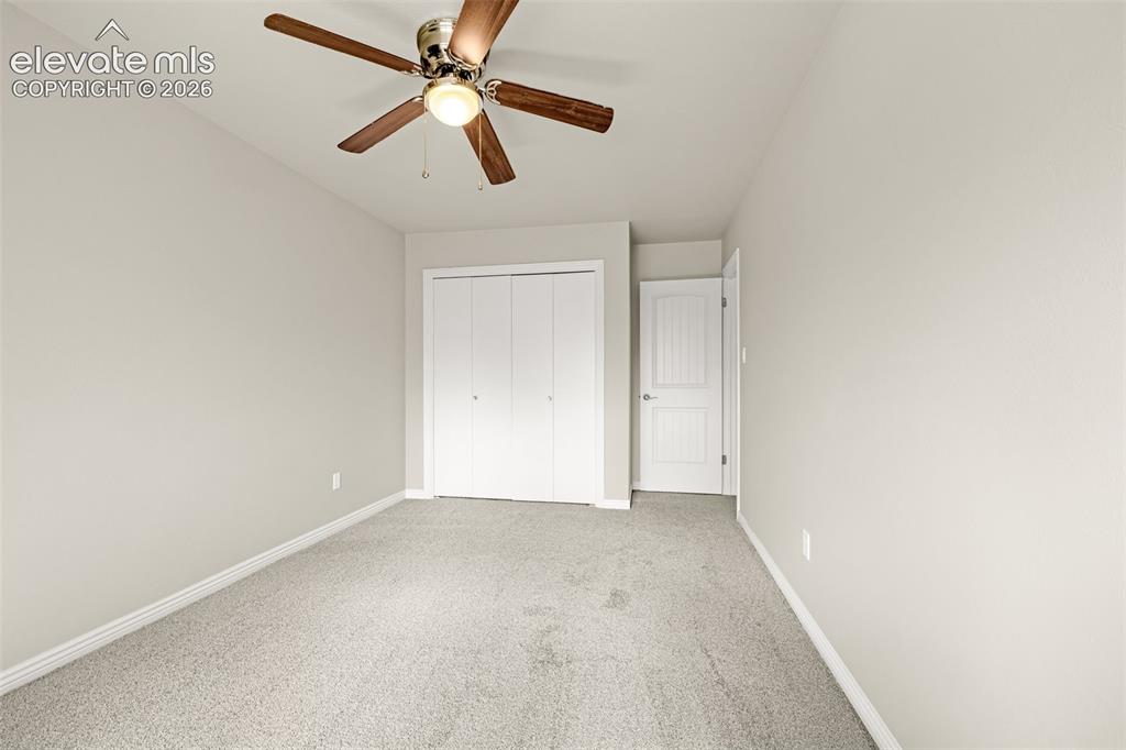 Image 17 of 40: Neutral-toned room featuring a window with natural light, textured walls, l