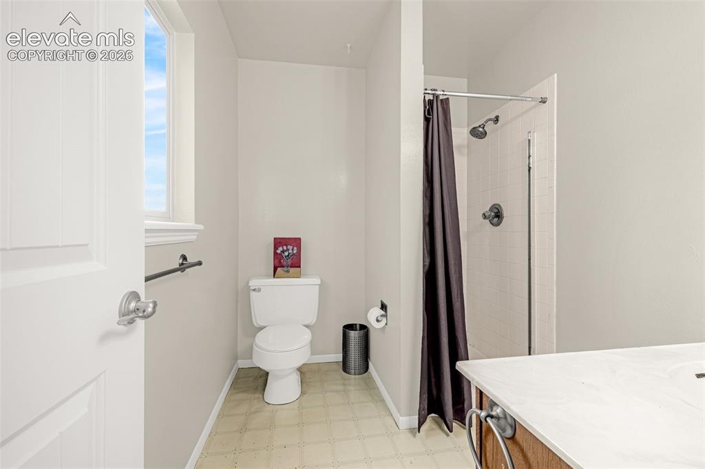 Image 23 of 40: Spacious room featuring light gray carpeting, a multi-panel closet with whi