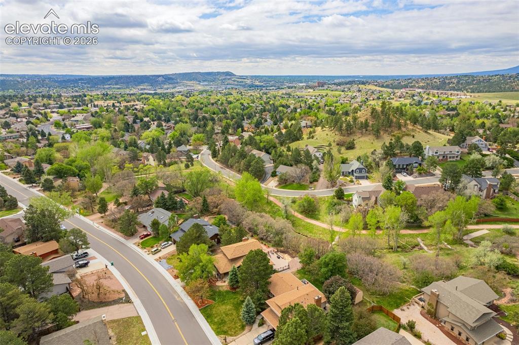Image 37 of 40: Expansive aerial perspective showcasing a residential area with varied home
