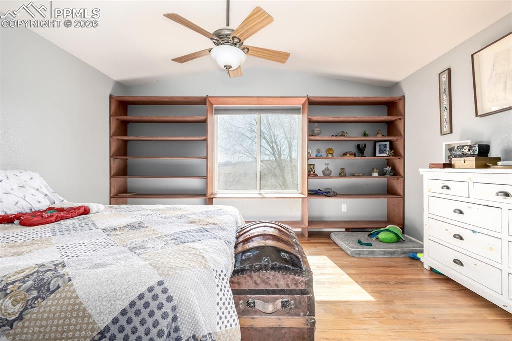 Image 15 of 37: Main Level Primary Suite with Built In Books Cases & 5 Piece En Suite Bathr