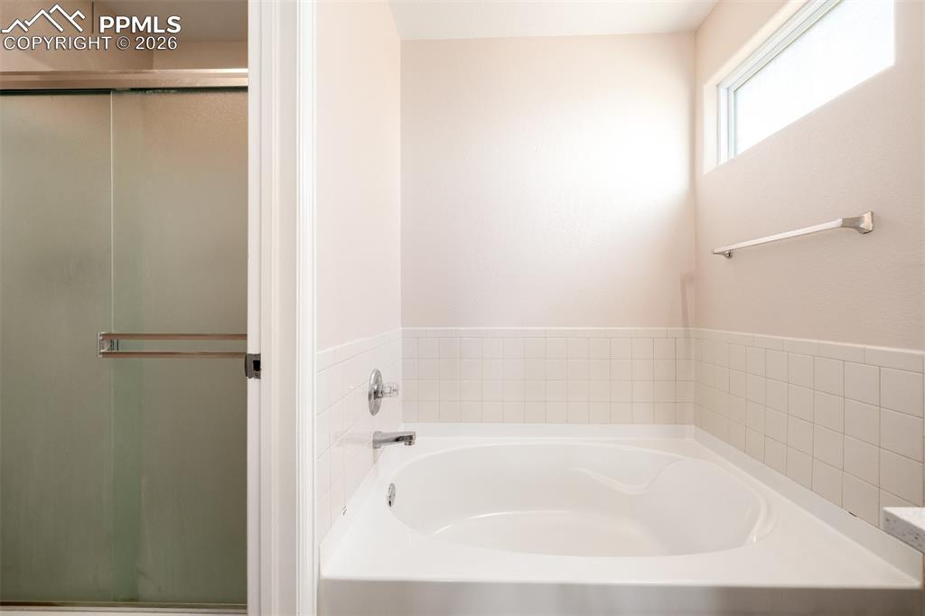Image 16 of 37: 5 Piece Primary Bathroom with Shower and Garden Tub