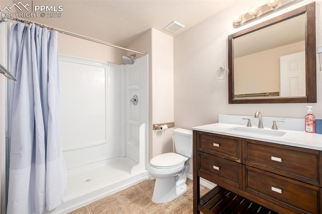 Image 21 of 37: Lower Level Bathroom