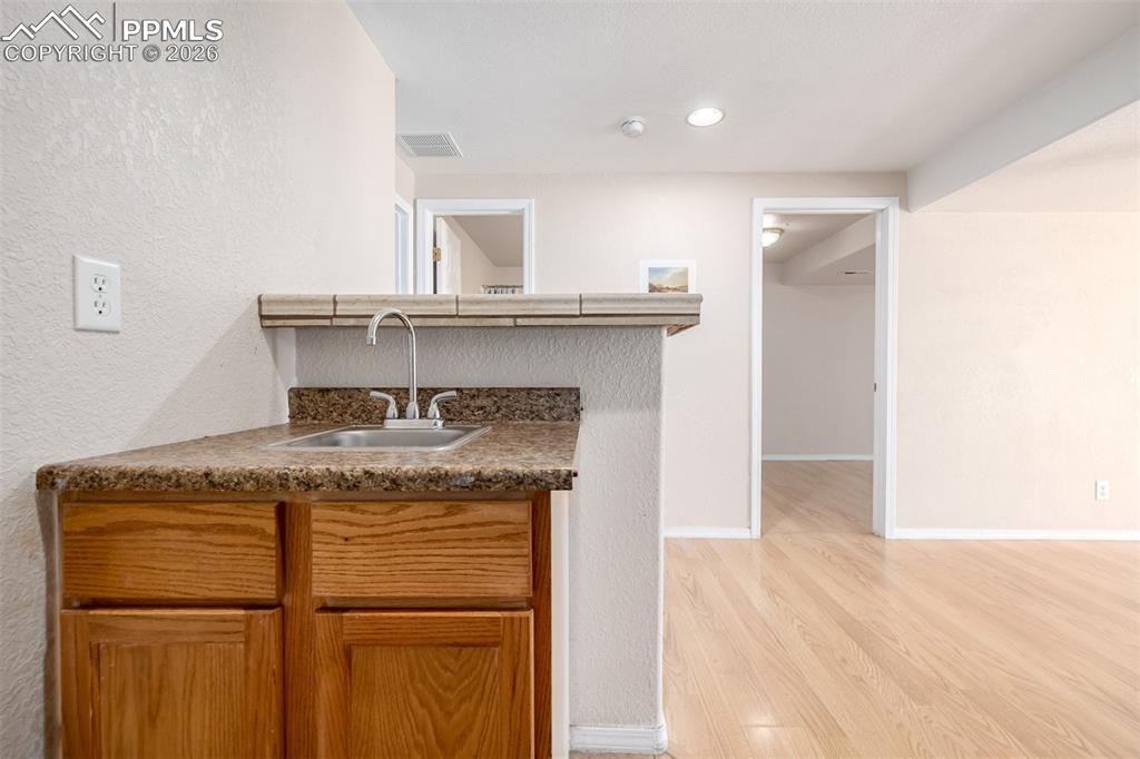 Image 23 of 37: Lower Level Wet Bar