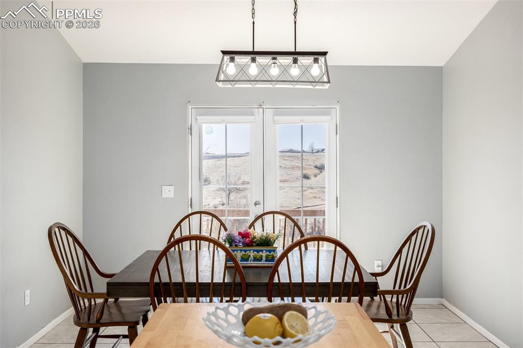 Image 6 of 37: Dining Area Overlooking Mountain Views and Open Space