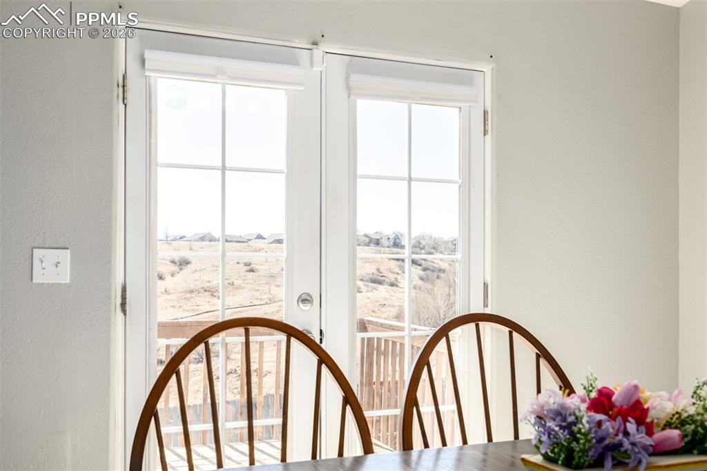 Image 7 of 37: Dining Area Overlooking Mountain Views and Open Space