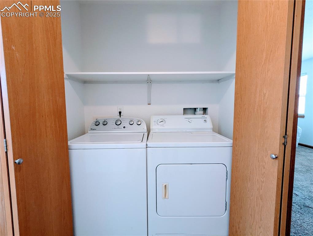 Image 17 of 19: Laundry room with washing machine and clothes dryer
