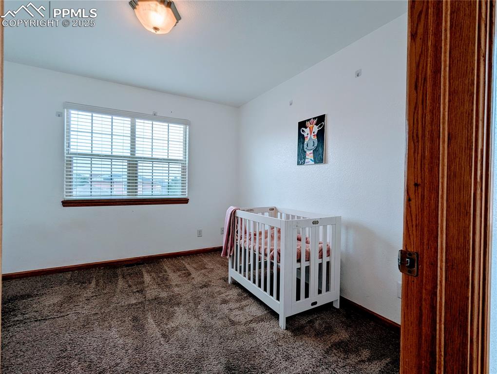 Image 8 of 19: Bedroom 1 featuring carpet floors and baseboards