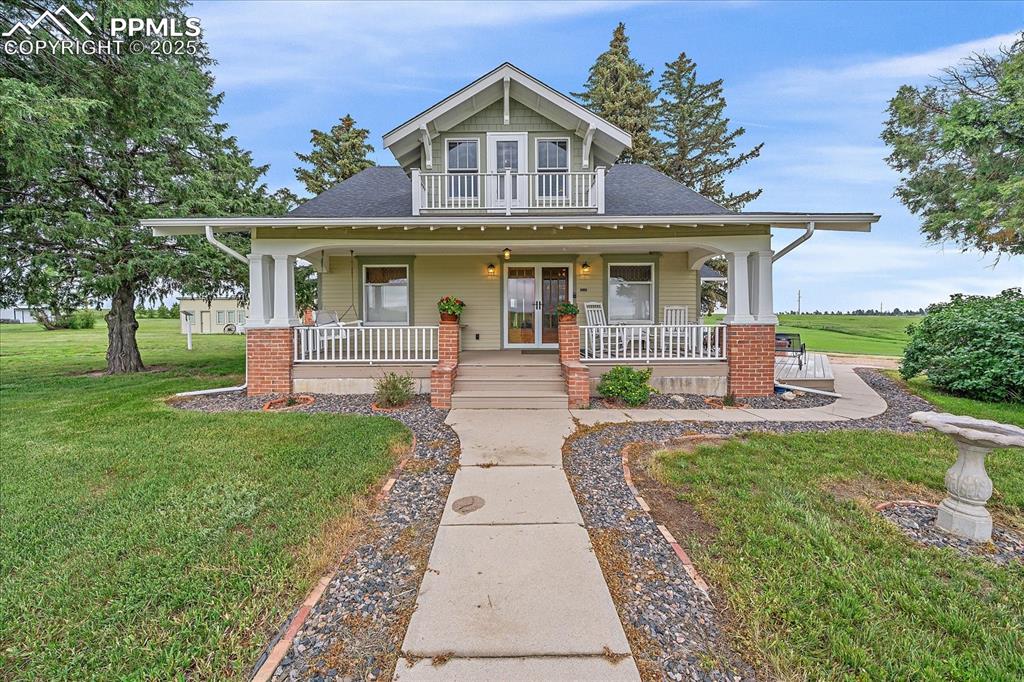 Image 1 of 44: View of front of home featuring a shingled roof, covered porch, and a front