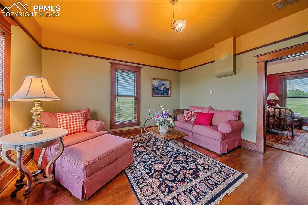 Image 30 of 44: Living room featuring wood-type flooring
