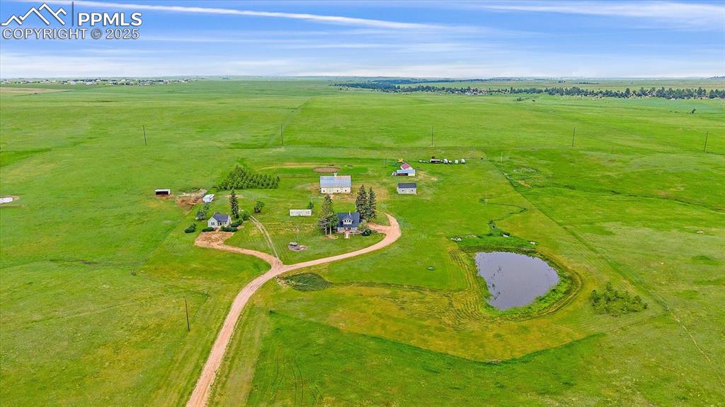 Image 38 of 44: Overview of rural landscape featuring a large body of water