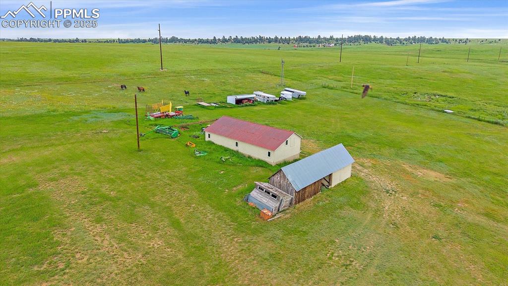 Image 42 of 44: Aerial view of sparsely populated area featuring a pastoral area