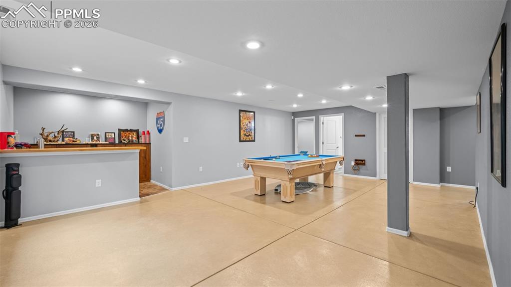 Image 14 of 28: Rec room featuring billiards table, concrete floors, and recessed lighting