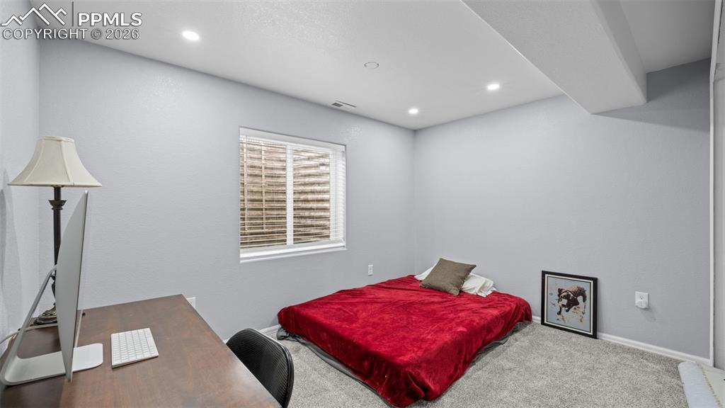 Image 17 of 28: Bedroom featuring carpet flooring, a desk, and recessed lighting
