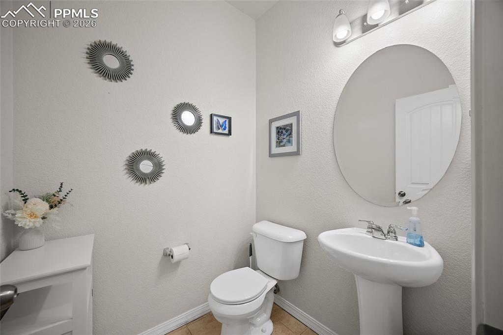 Image 11 of 37: Powder room on the lower level. 