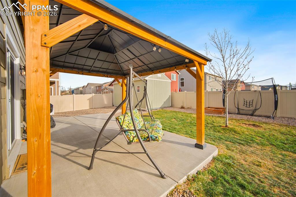 Image 33 of 37: Great coverage from rain or too much sun!  Covered Patio!