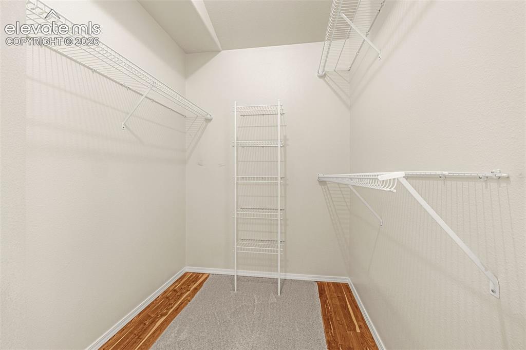 Image 24 of 41: Large Primary walk in closet with cedar