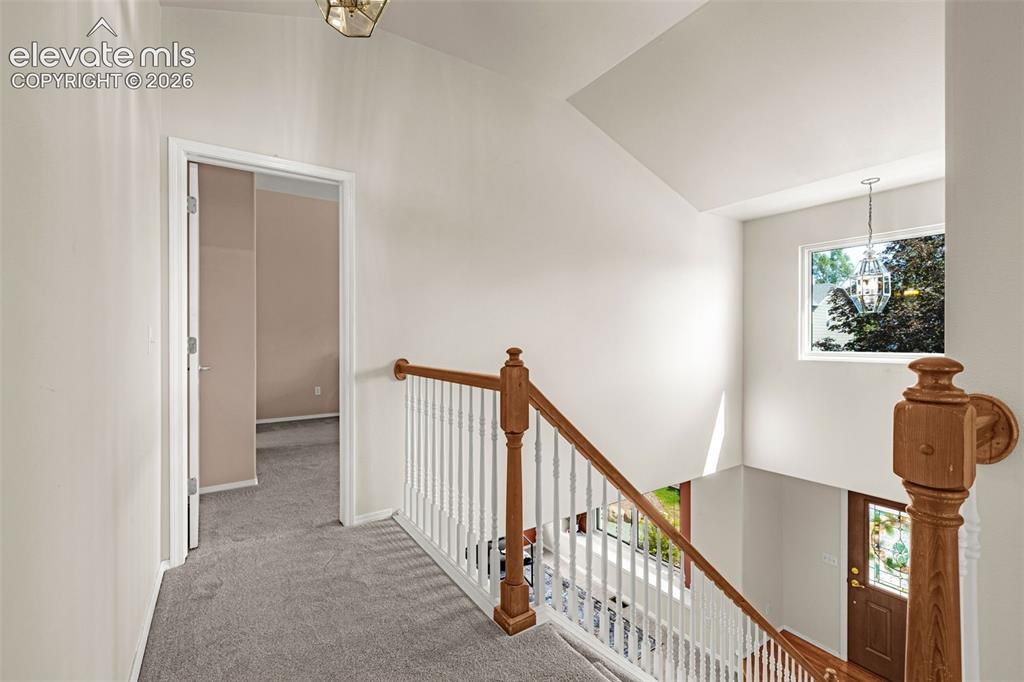 Image 25 of 41: Upstairs landing into Primary Suite