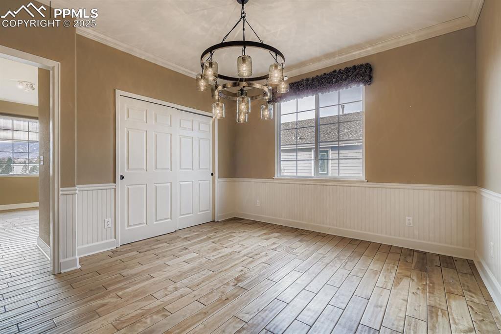 Image 6 of 27: Formal dining room that is also a legal bedroom