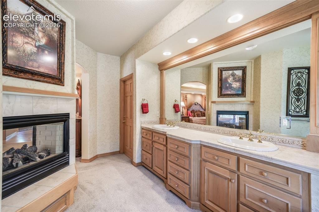 Image 25 of 50: Extended Heigh Vanity & Dual Sided Gas Fireplace