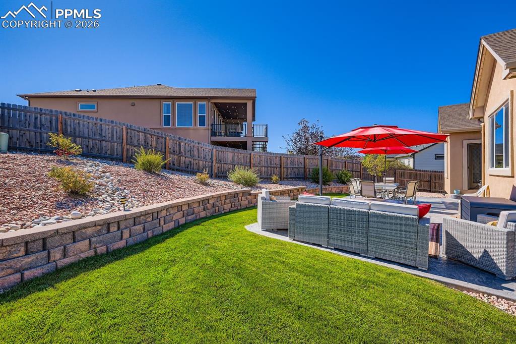 Image 25 of 33: Professionally landscaped rear yard