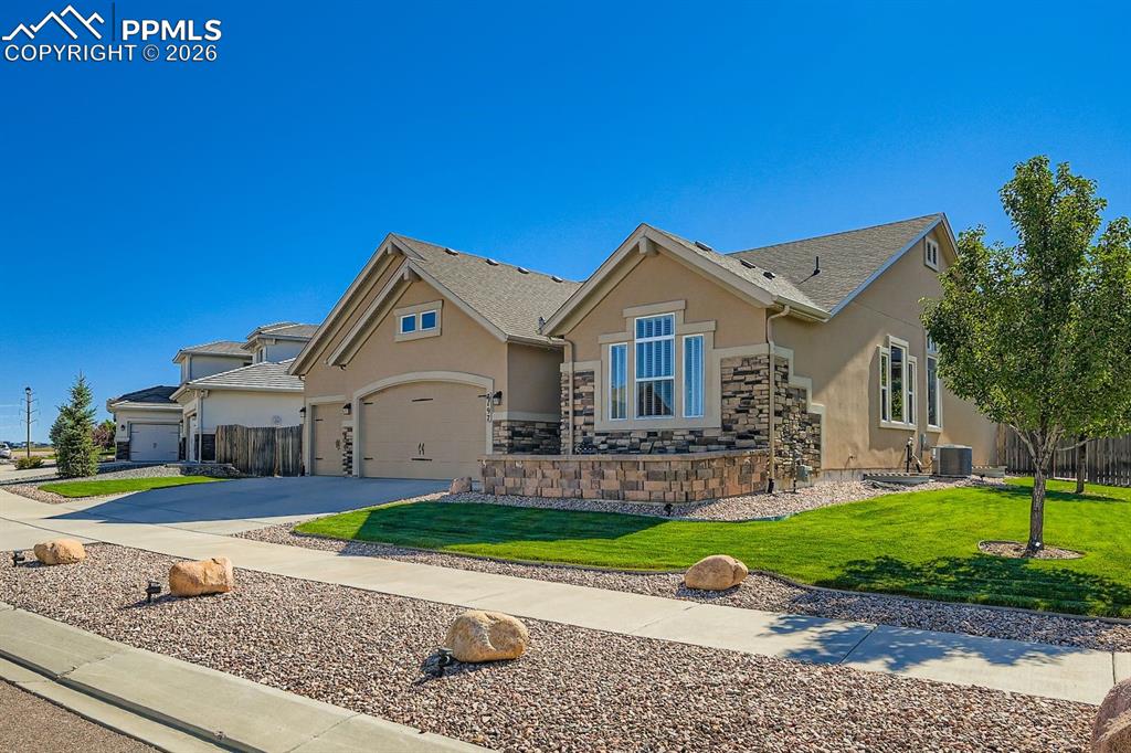 Image 30 of 33: Under eve "Gemstone Lighting" complements the exterior and can be changed t