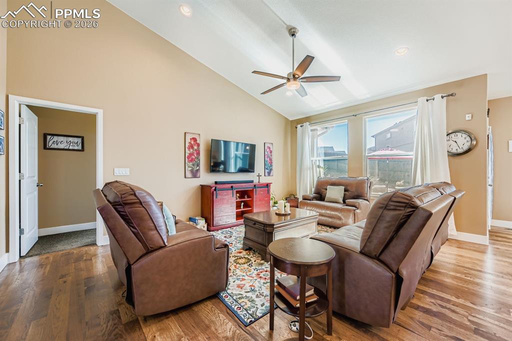 Image 4 of 33: Main level great room, hickory hardwood flooring, thought the main level an