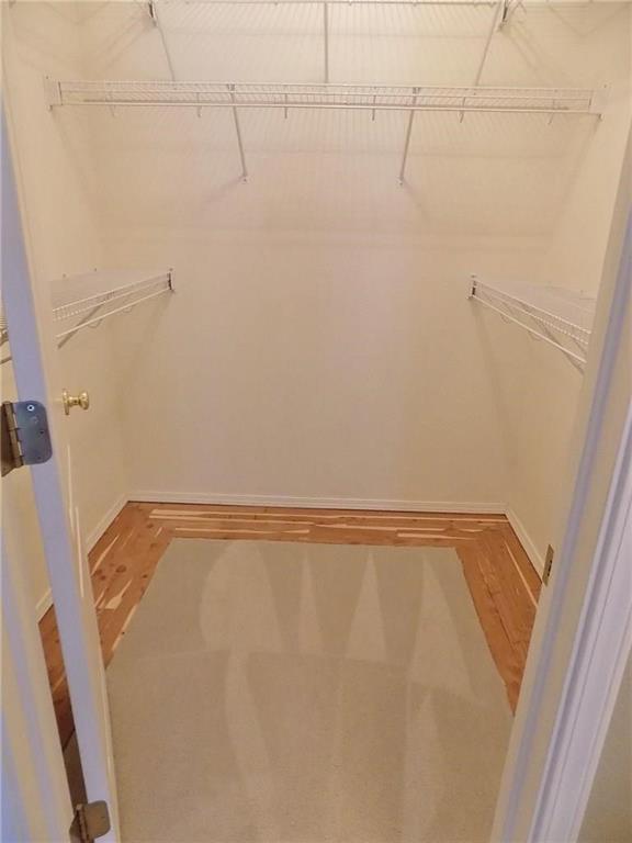 Image 21 of 37: Walk-in cedar lined closet