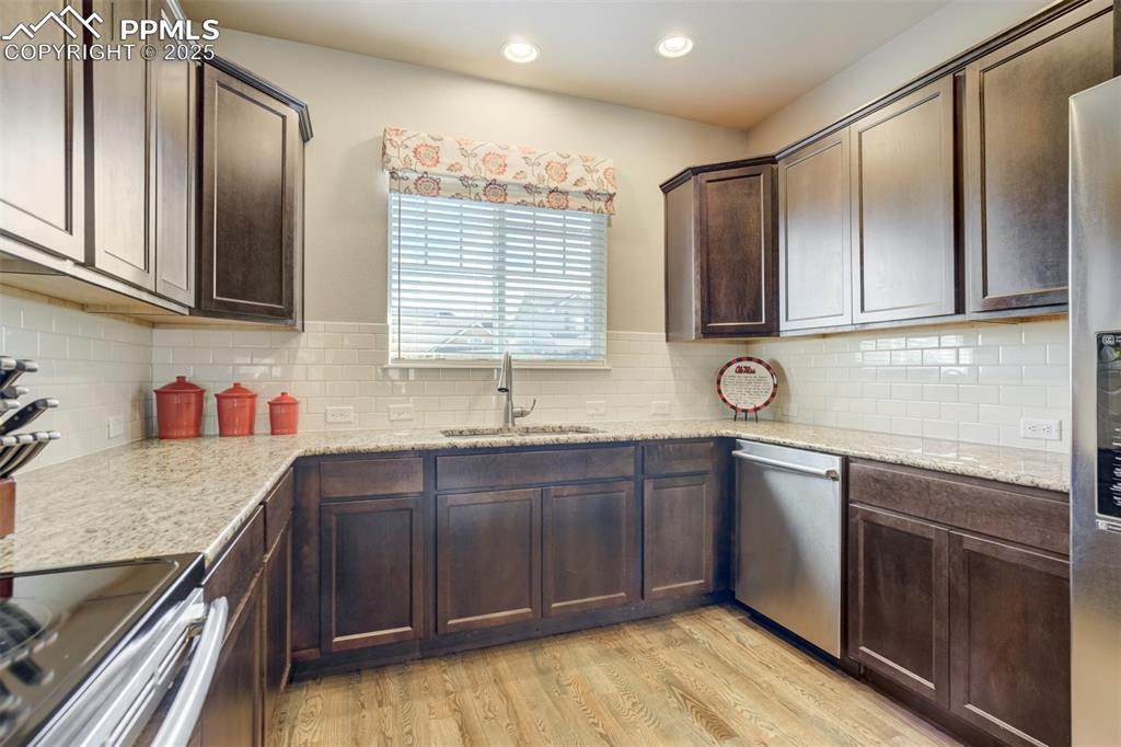 Image 11 of 42: Hickory cabinets and granite counter tops