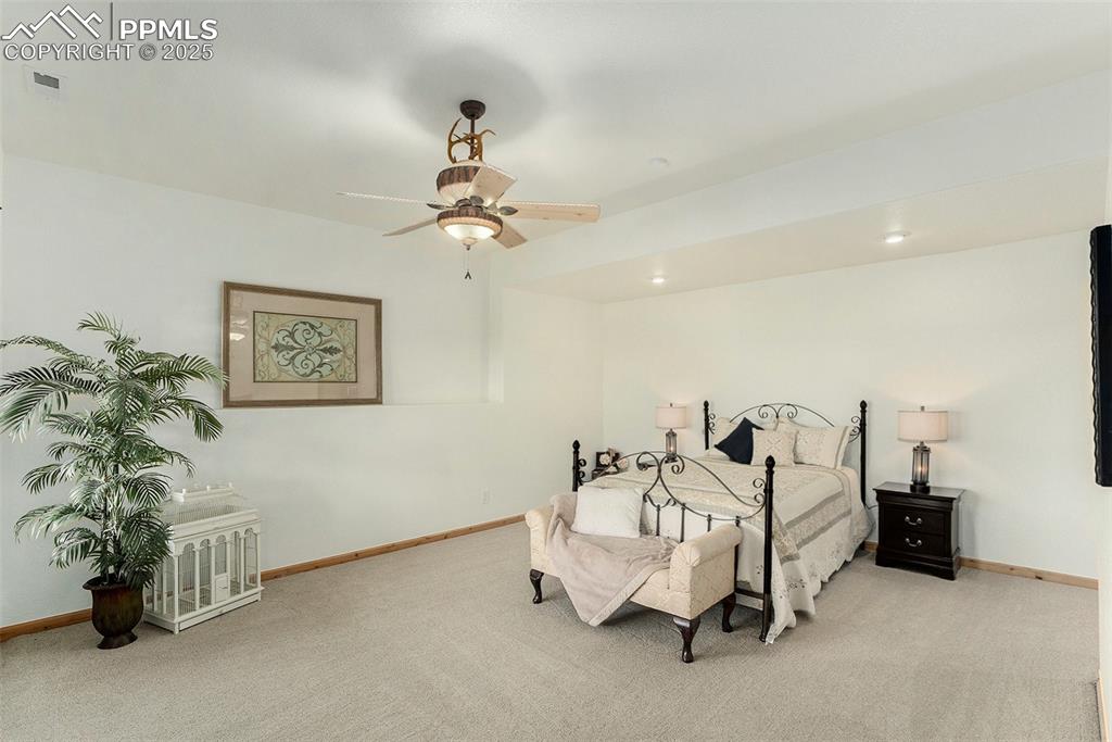 Image 22 of 47: Carpeted bedroom featuring baseboards and a ceiling fan