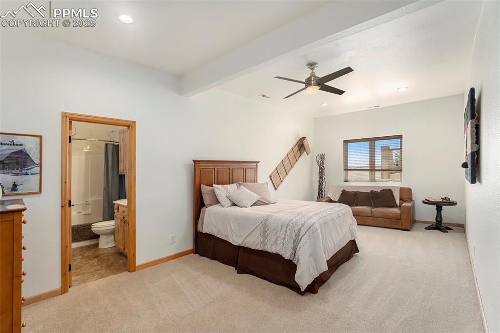 Image 27 of 47: Bedroom with light carpet, beam ceiling, recessed lighting, ceiling fan, an