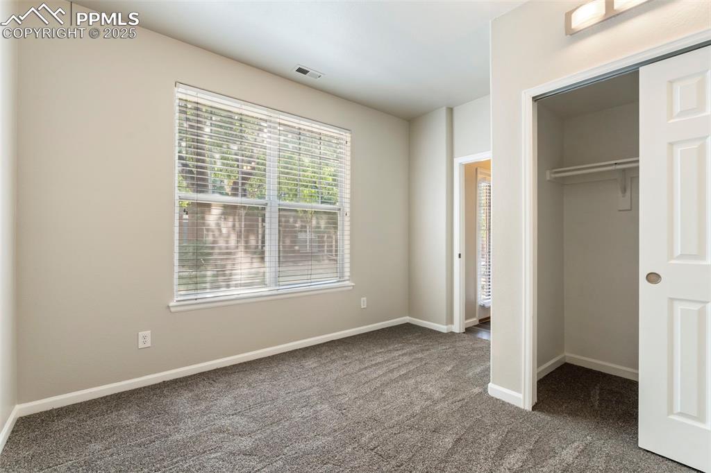Image 39 of 48: Unfurnished bedroom with carpet floors and a closet