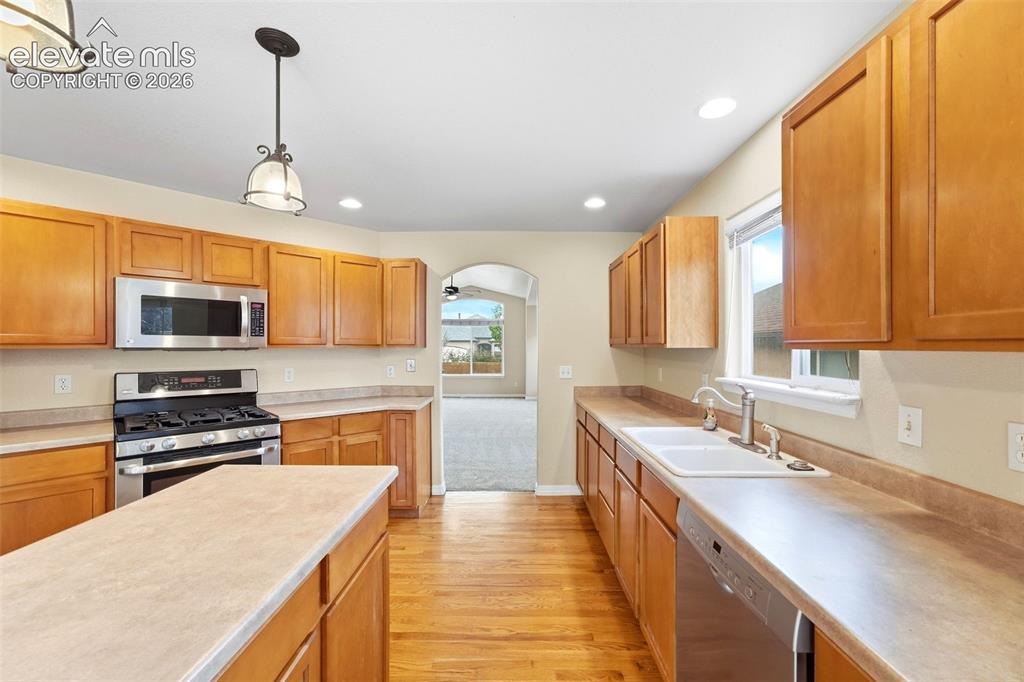 Image 11 of 47: Stainless Steel Appliances and Well Appointed Island