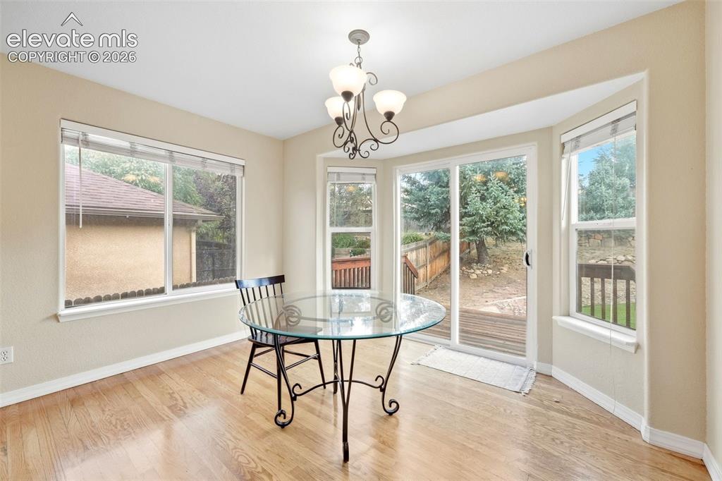 Image 13 of 47: Eat in Kitchen with Dining Area and Walk Out to Backyard