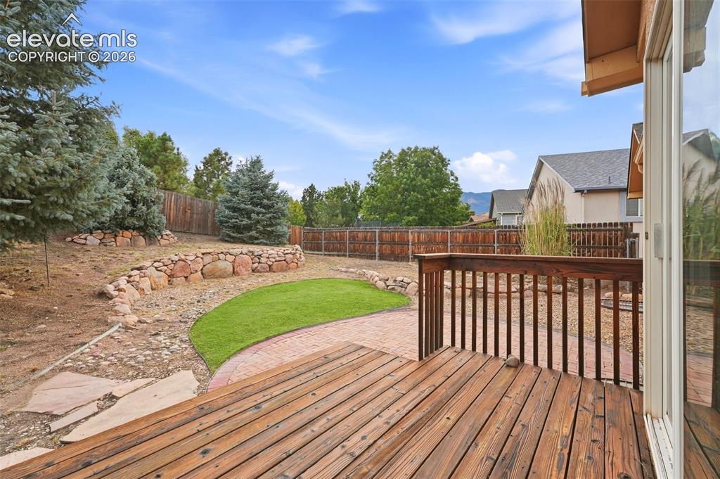 Image 14 of 47: Low Maintenance Landscaping in Fenced Backyard