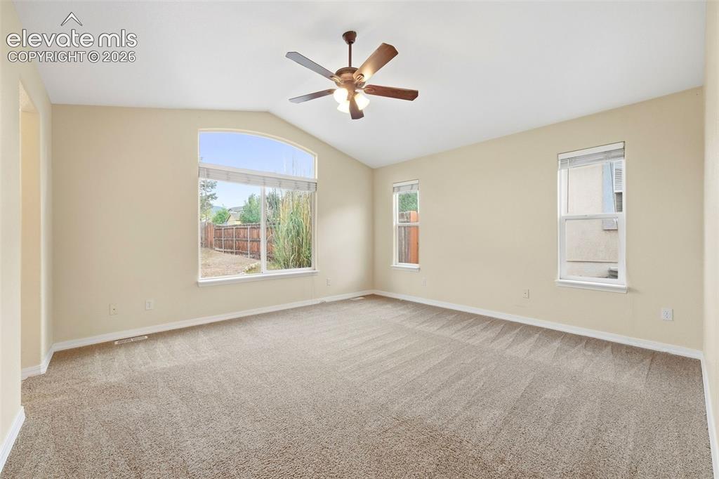 Image 18 of 47: Main Level Primary Bedroom with Vaulted Ceilings