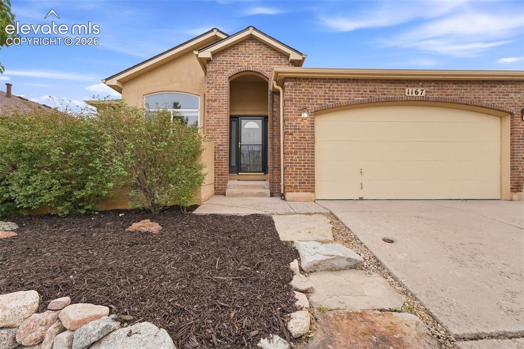Image 2 of 47: Refreshed Landscaping, Stunning Stucco and Brick Exterior
