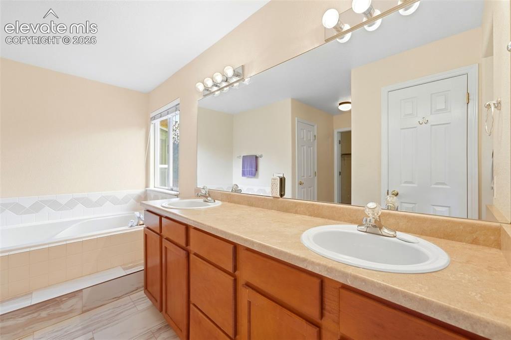 Image 20 of 47: Primary Bathroom featuring Spacious Dual Vanities