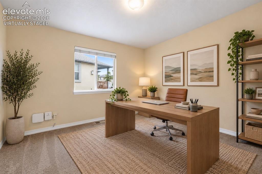 Image 24 of 47: Virtually Staged Main Level Bedroom/Office