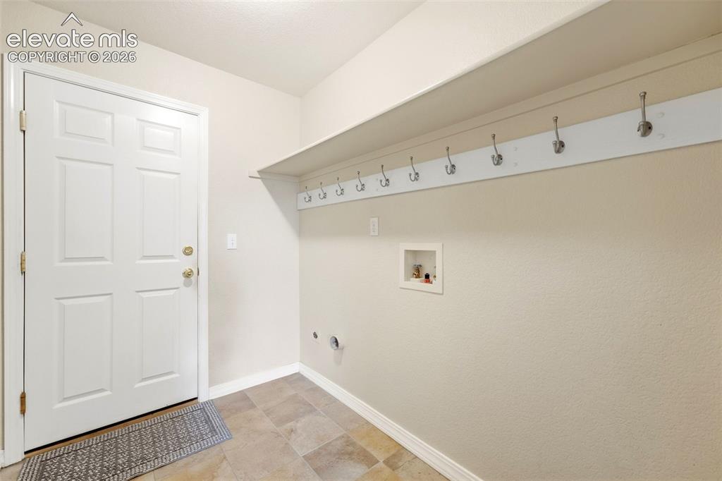 Image 28 of 47: Main Level Laundry, Door to Garage