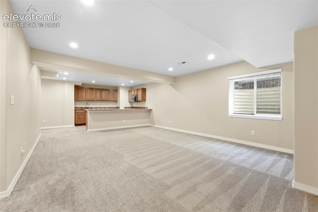 Image 30 of 47: View of Kitchenette from Family Room in Basement