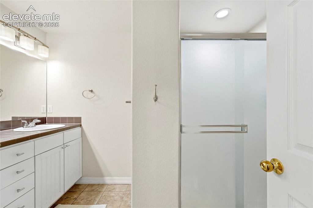 Image 41 of 47: Bathroom in Basement with Walk In Shower