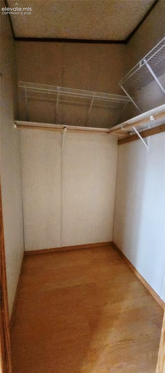 Image 18 of 25: Primary closet