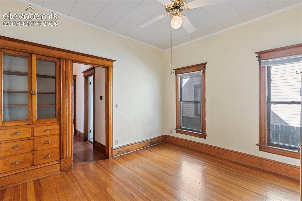 Image 15 of 31: Bedroom #1 with original built in wardrobe